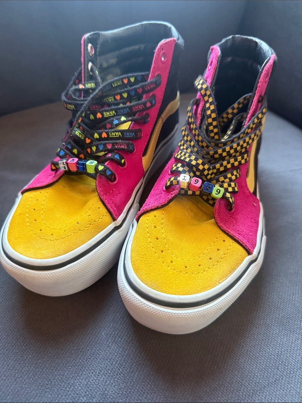 Vans women’s  High-Top Sneakers in Yellow and Pink with Checkerboard Laces